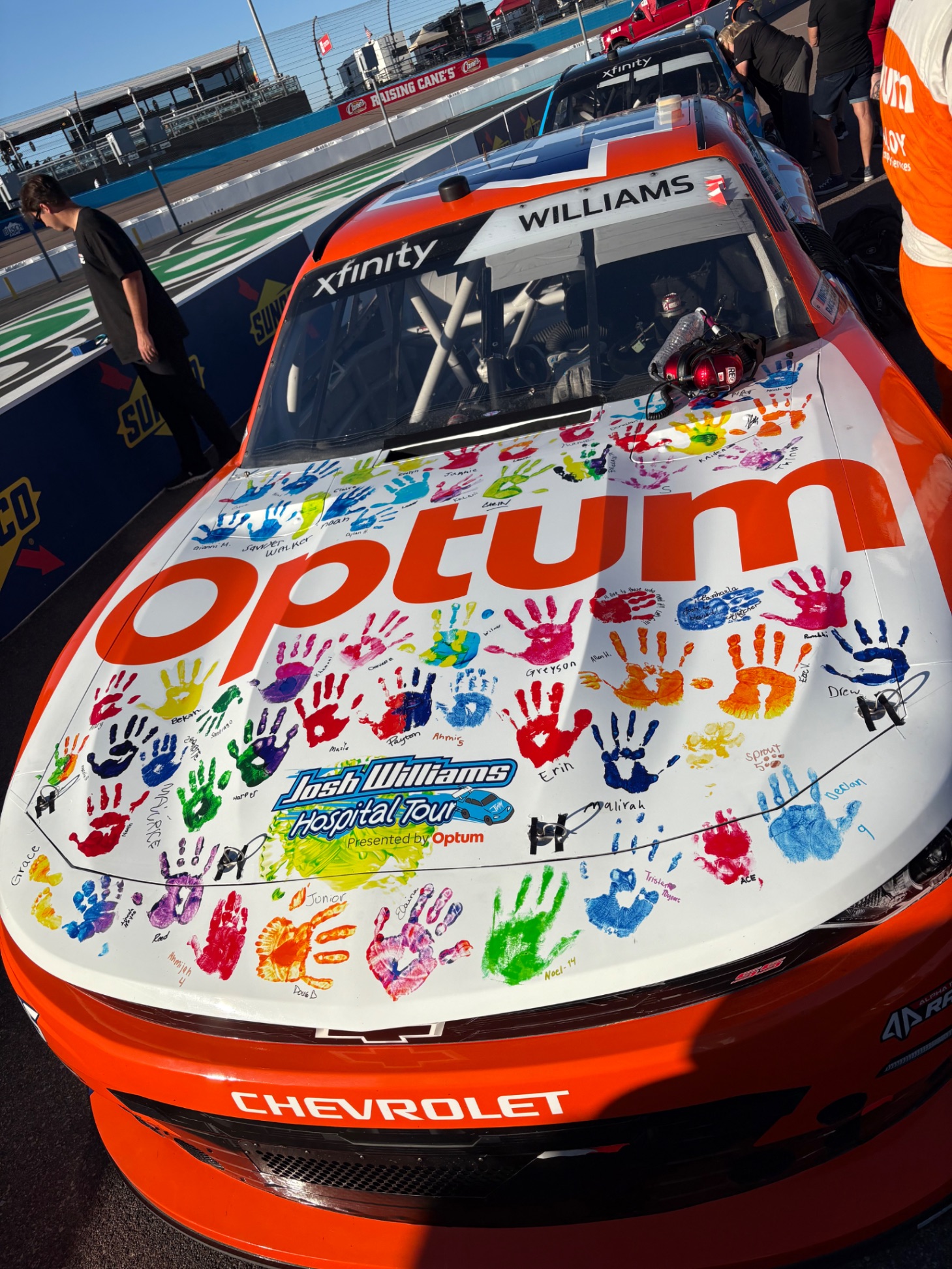 Josh Williams collecting a child's handprint during the Hospital Tour